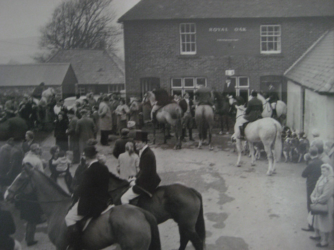 A hunt preparing to set off from The Royal Oak in the early 60s